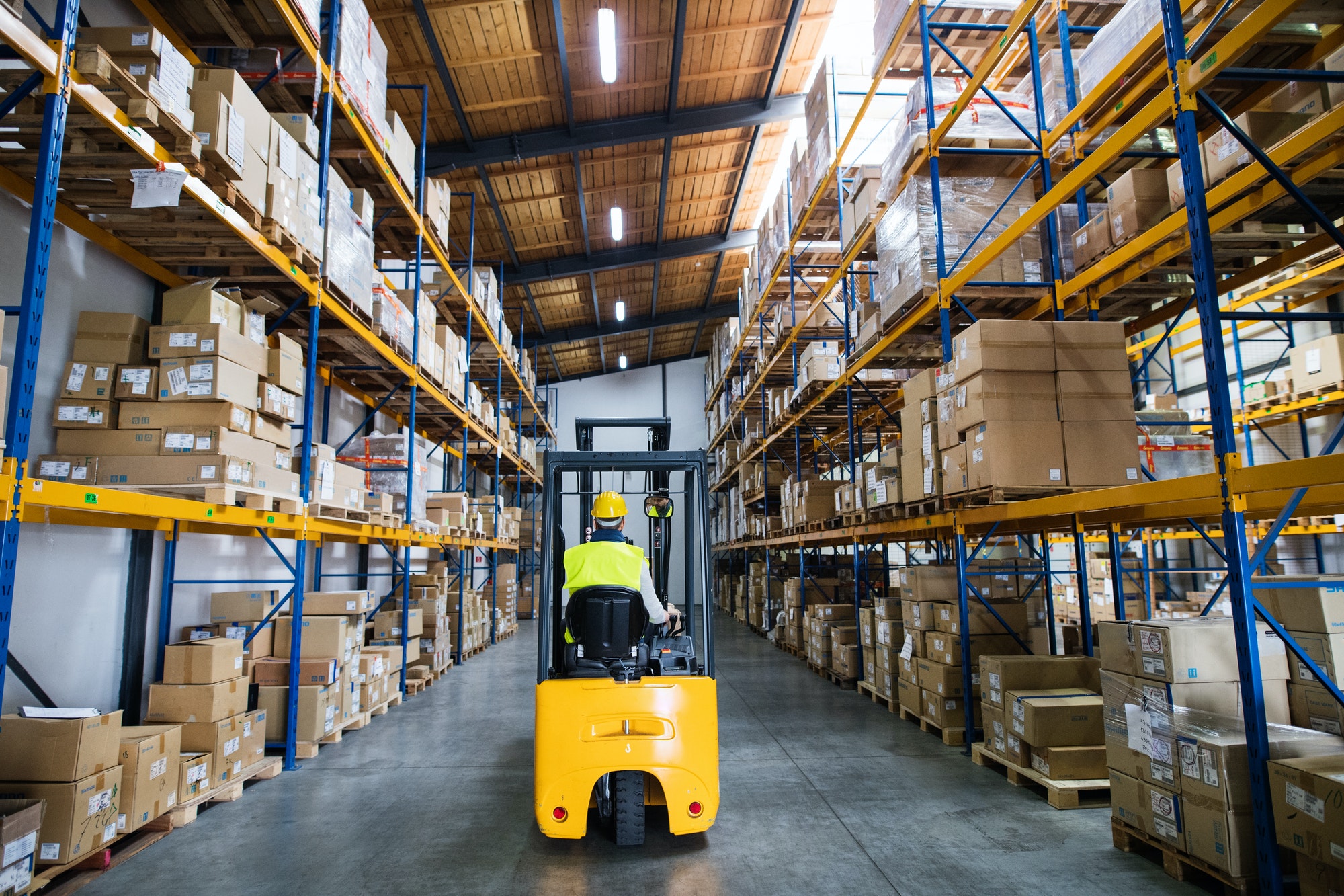 Warehouse man worker with forklift.